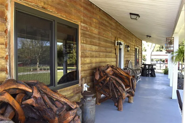 a bedroom with furniture and a large window