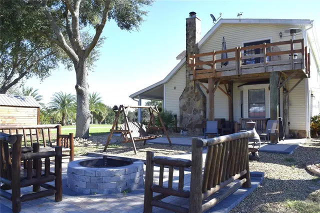 a front view of a house with outdoor seating