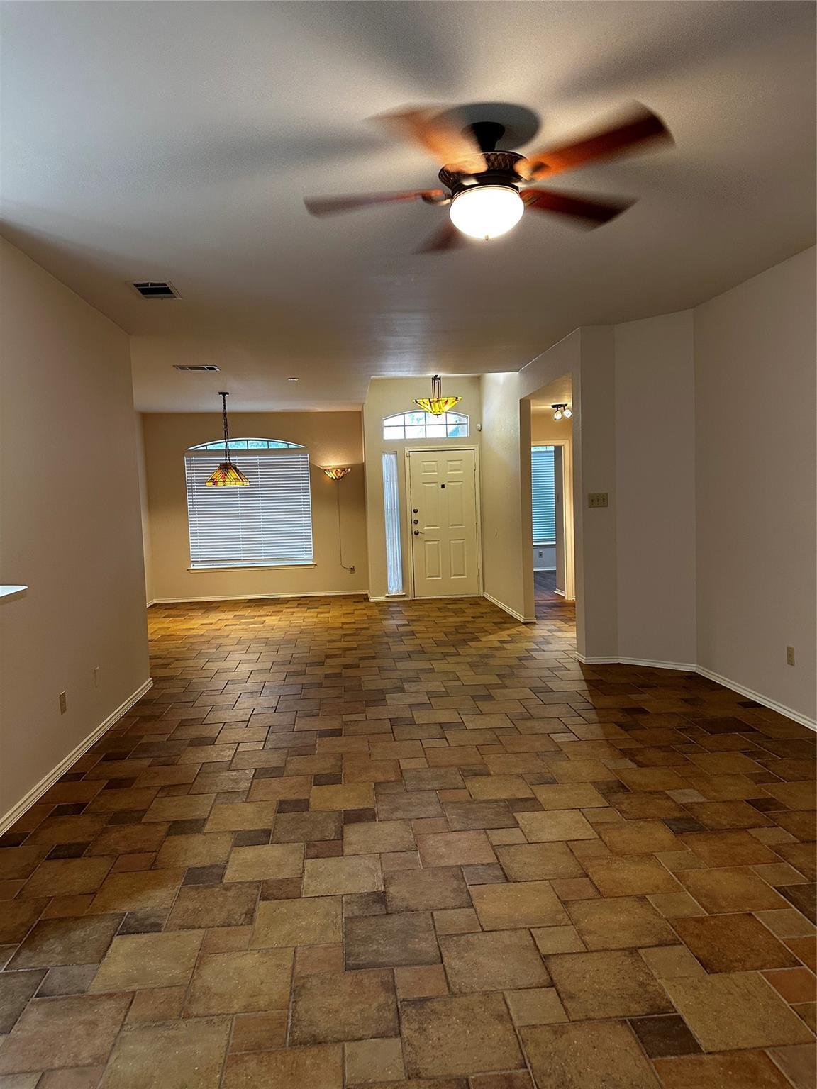 8007 Bounty Trail Austin, TX 78749 - Photo 14 of 32 A welcoming entryway with patterned tile flooring opens to a spacious living area.