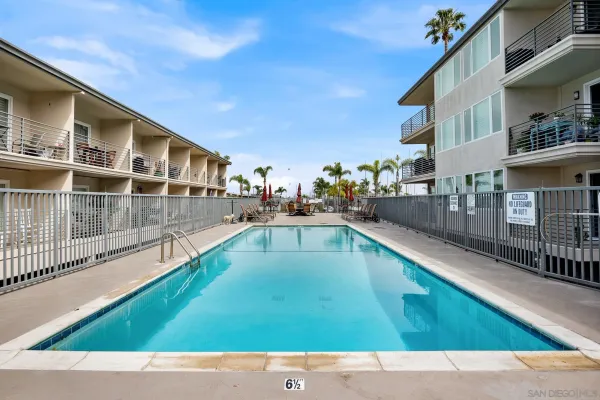 a view of swimming pool with outdoor seating