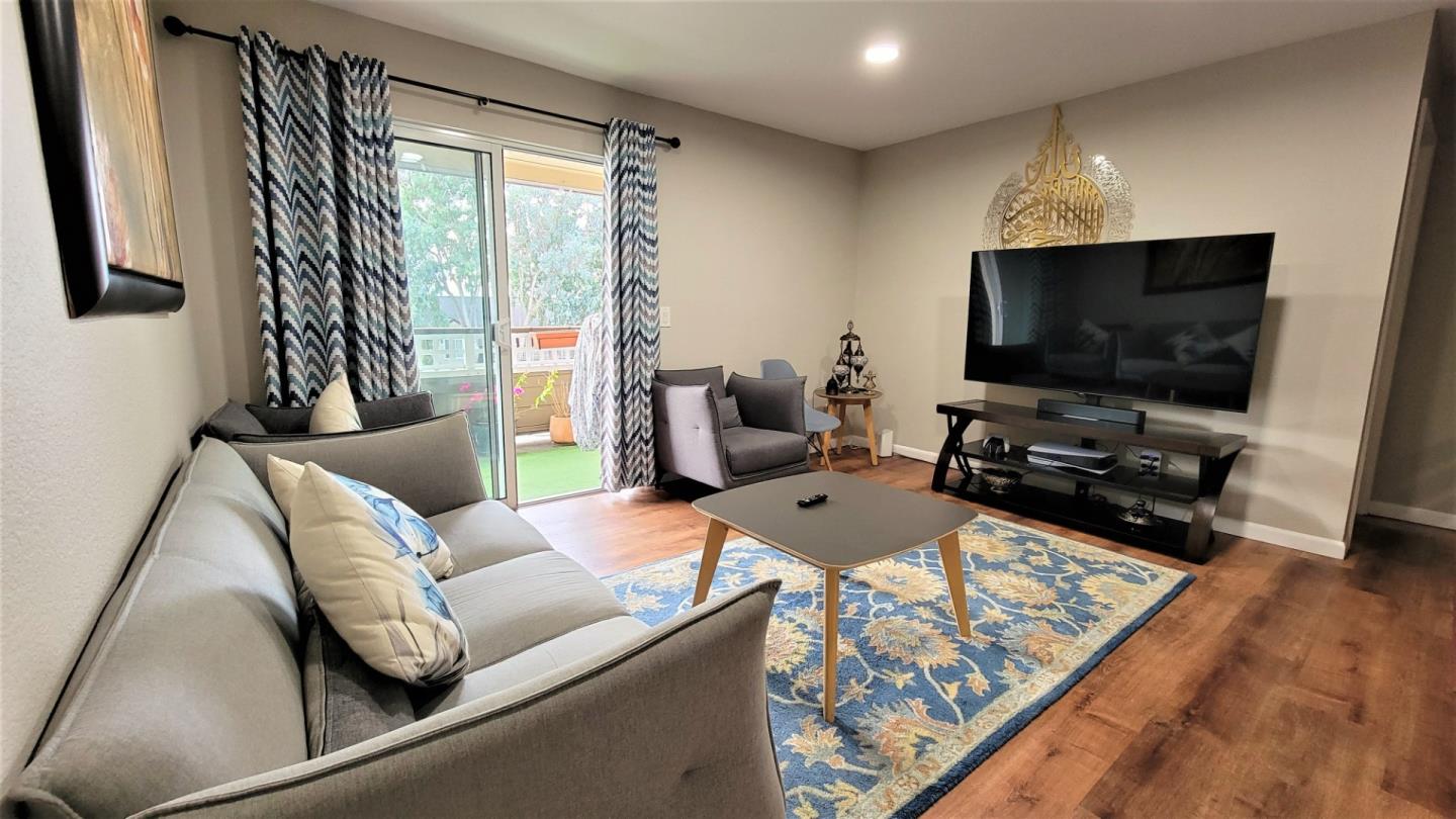 680 Dartmore Lane, Unit 259 Hayward, CA 94544 - Photo 12 of 25 a living room with furniture and a flat screen tv