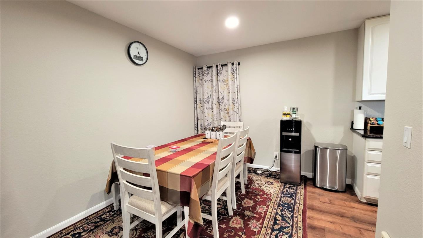 680 Dartmore Lane, Unit 259 Hayward, CA 94544 - Photo 18 of 25 a dining room with furniture and wooden floor