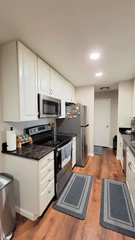 a kitchen with lots of counter space and appliances