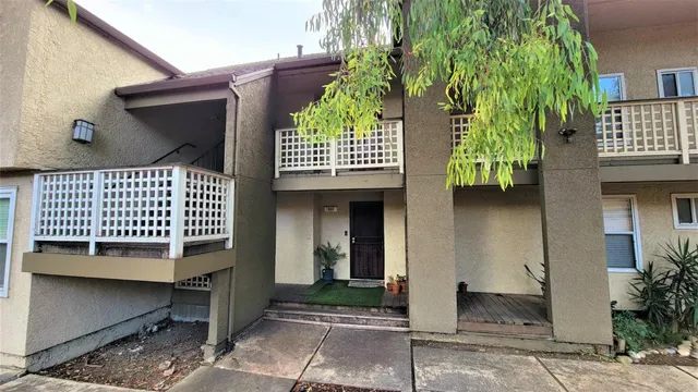 a view of a car park in front of house