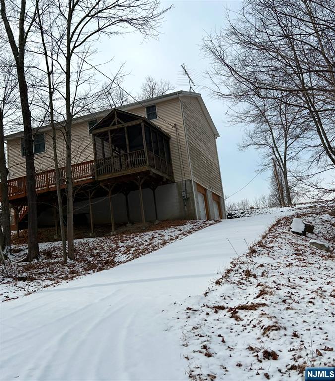 16 Crest Road Sussex, NJ 07461 - Photo 11 of 11 a house with trees in the background