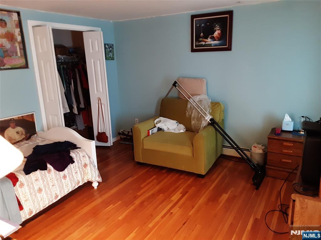 16 Crest Road Sussex, NJ 07461 - Photo 7 of 11 a bedroom with a bed and wooden floor
