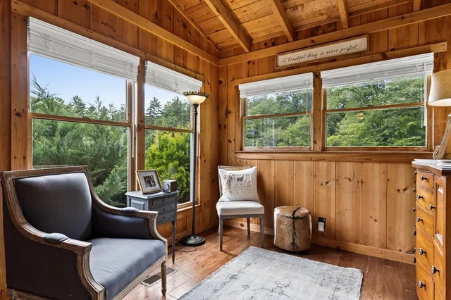 a living room with furniture and a rug