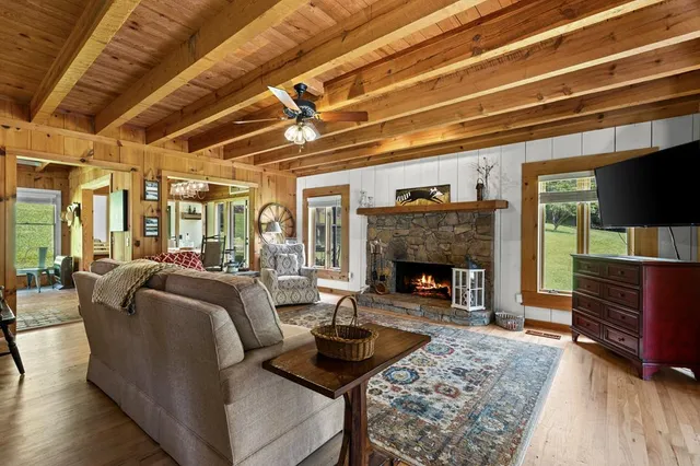 a balcony with wooden floor and fence