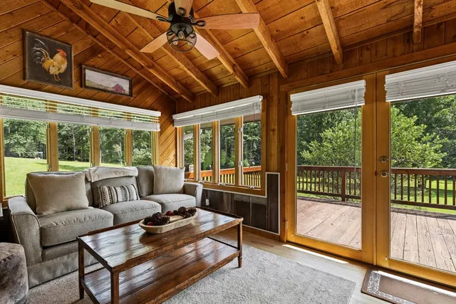 an aerial view of a house with pool lake view and mountain view