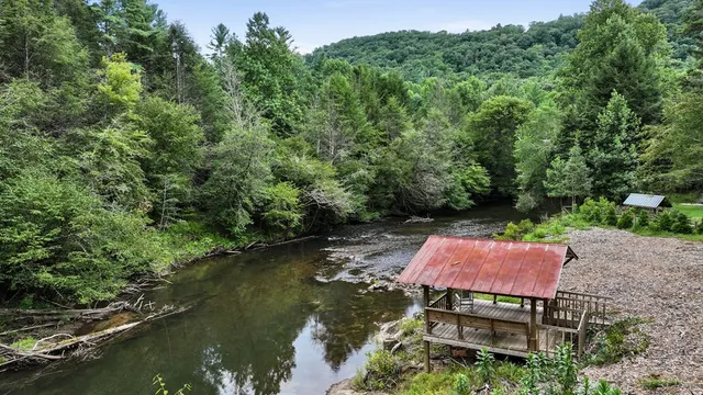 a view of a house with a backyard and a patio
