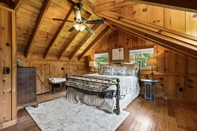 a backyard of a house with a yard and outdoor seating