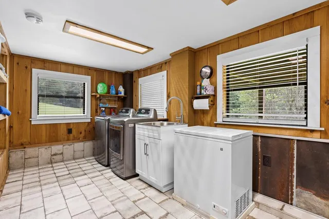 a bed room with a bed and a television