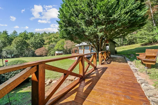 a bedroom with furniture and a large window