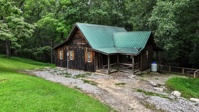 a view of an empty room with wooden walls