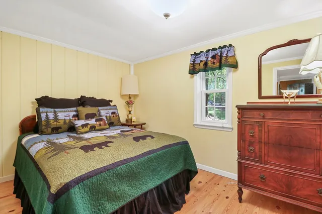 a view of a lush green hillside and a houses