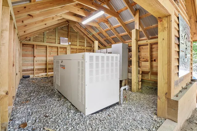 a aerial view of a house with a yard balcony and furniture