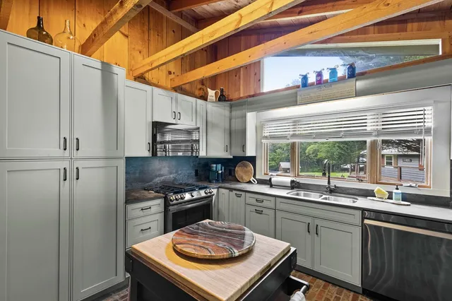 a bedroom with a large bed and a large window