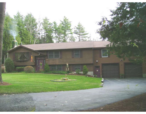 82 Wheeler Road Princeton, MA 01541 - Photo 3 of 25 a front view of a house with a yard garage and outdoor seating