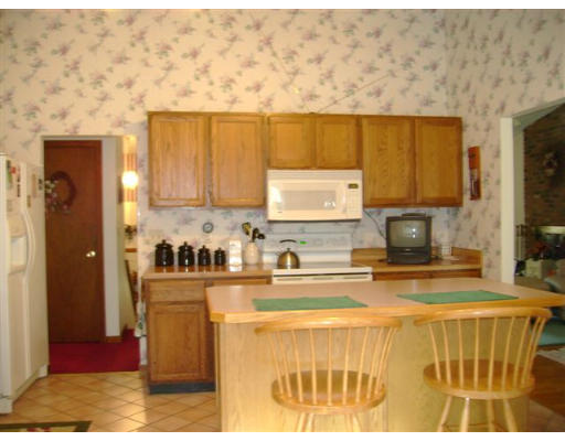 82 Wheeler Road Princeton, MA 01541 - Photo 7 of 25 a kitchen with granite countertop a sink and cabinets