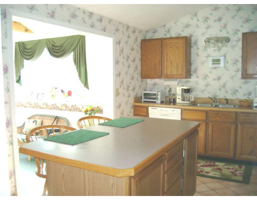 82 Wheeler Road Princeton, MA 01541 - Photo 8 of 25 a kitchen with a sink and a refrigerator
