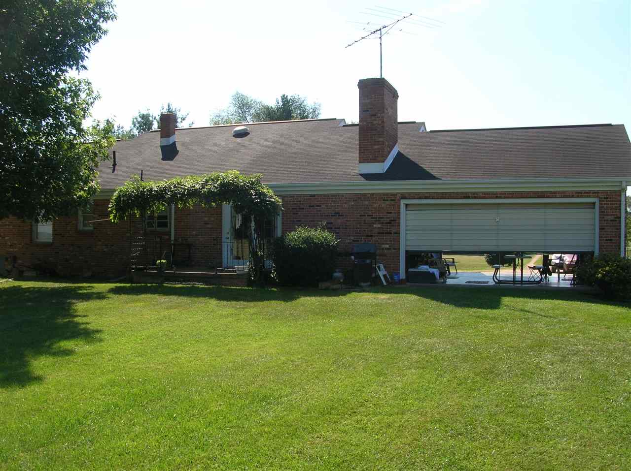 256 Kiddsville Road Fishersville, VA 22939 - Photo 3 of 13 a front view of a house with a garden