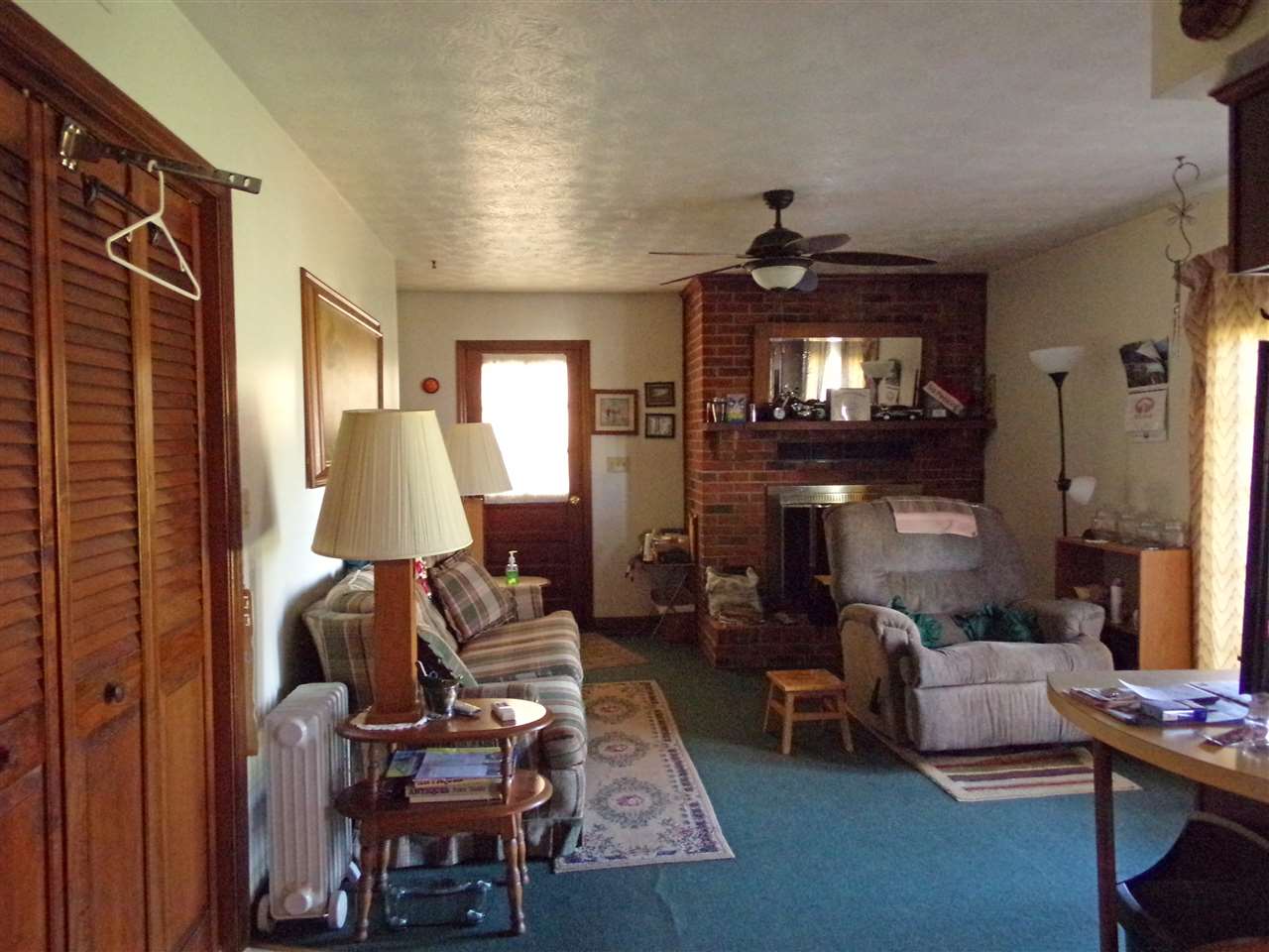 256 Kiddsville Road Fishersville, VA 22939 - Photo 8 of 13 a living room with furniture a fireplace and a flat screen tv