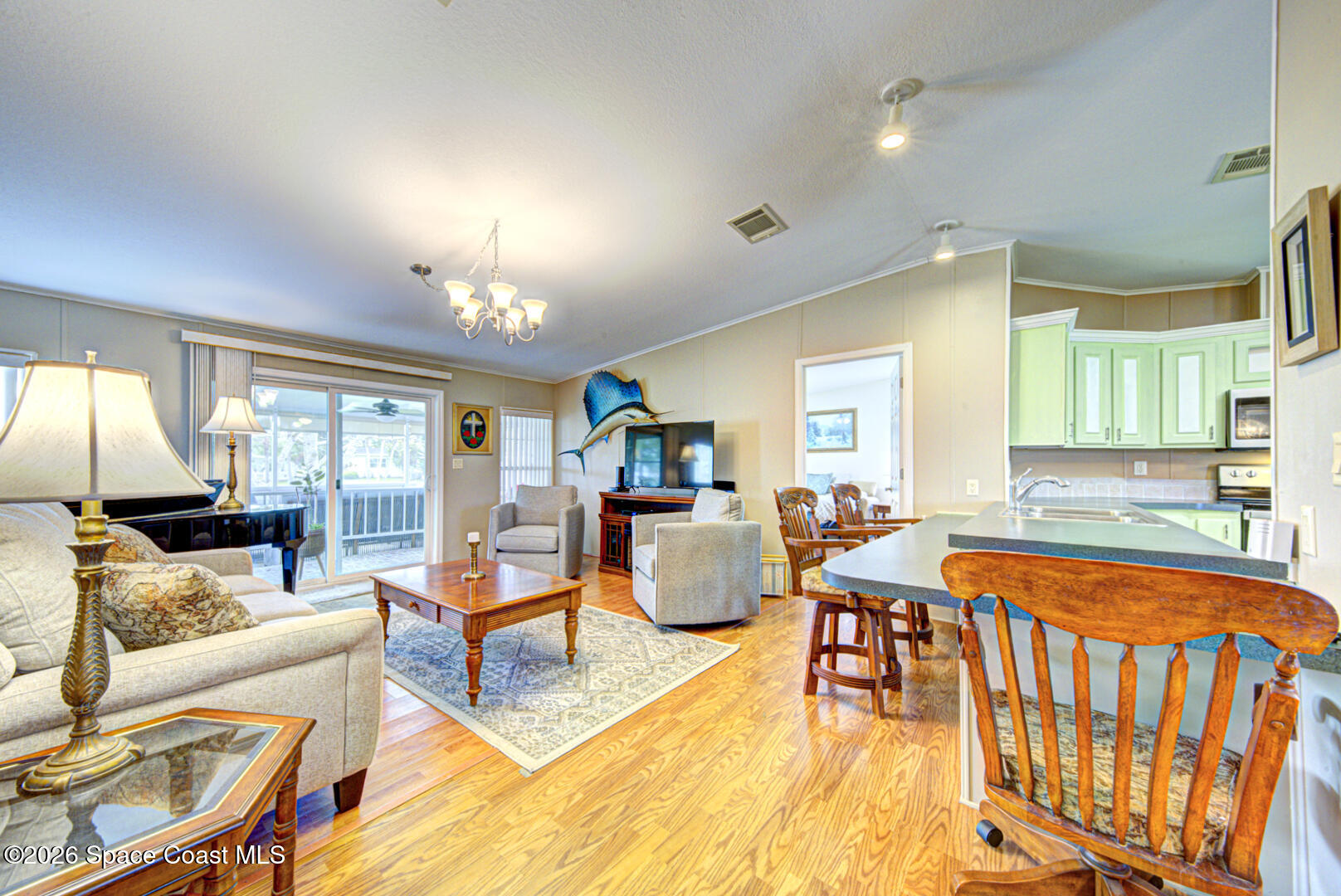 259 Timber Run Way Cocoa, FL 32926 - Photo 17 of 50 19 kitchen bar & living room