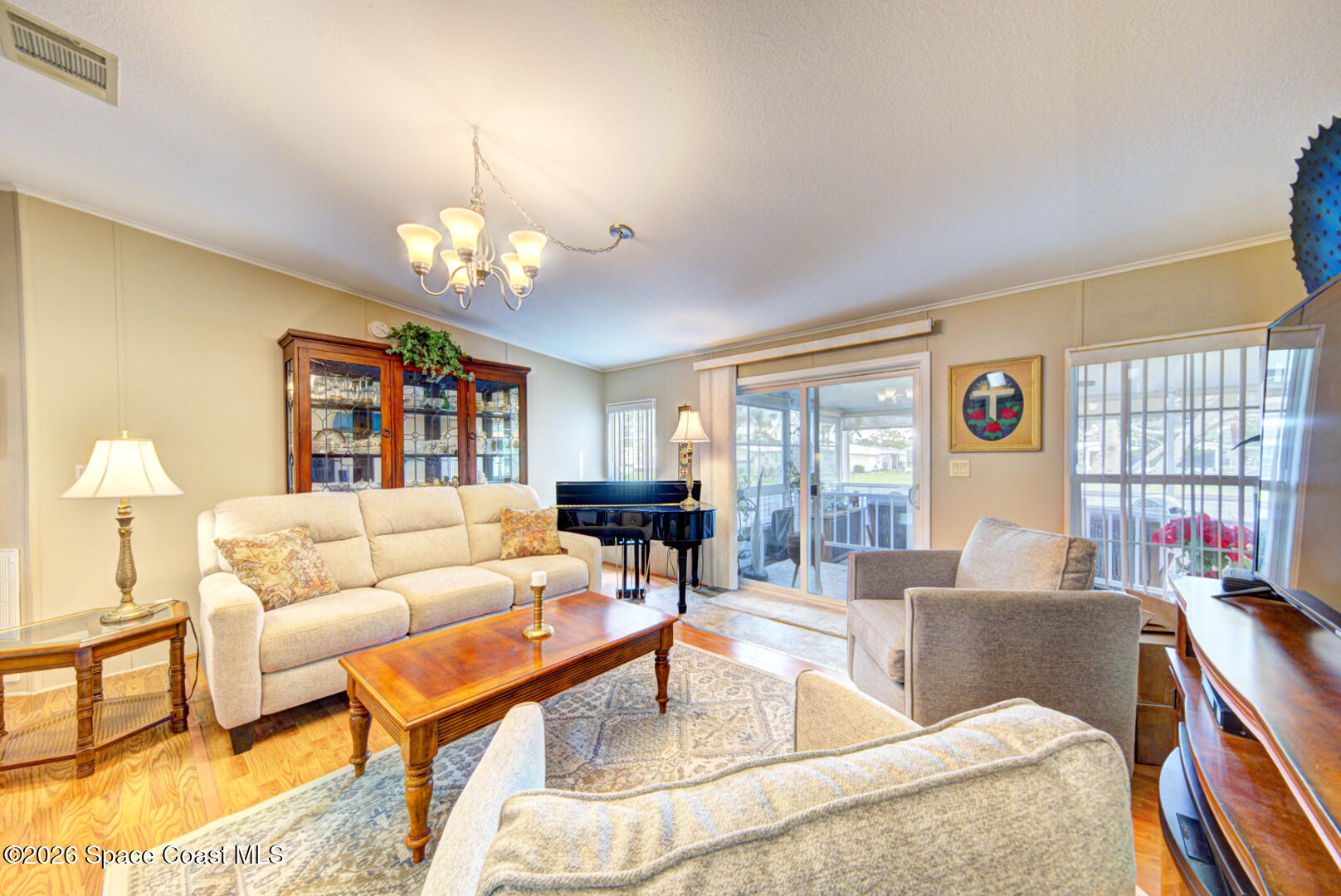 259 Timber Run Way Cocoa, FL 32926 - Photo 19 of 50 21 living room with slider to porch
