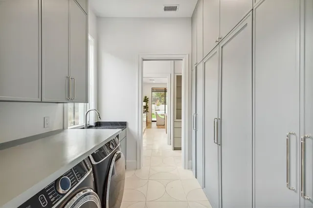 a kitchen with a sink and cabinets