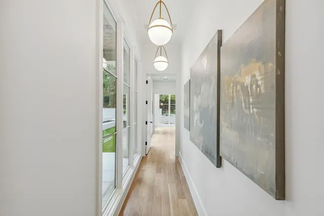 a view of a bathroom from a hallway
