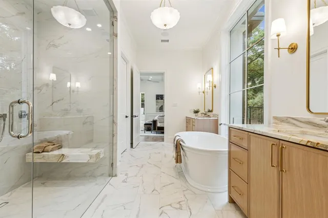 a spacious bathroom with a bathtub sink and toilet
