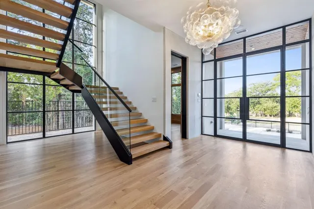a view of an entryway with wooden floor