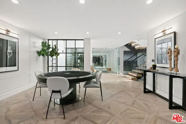 a view of a dining room with furniture and window