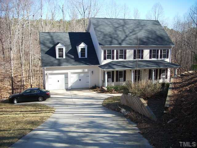 5204 6 Pence Court Raleigh, NC 27613 - Photo 15 of 17 Another view of the front; note the terraced gardens and the woods surrounding this beautiful property. Exterior Front
