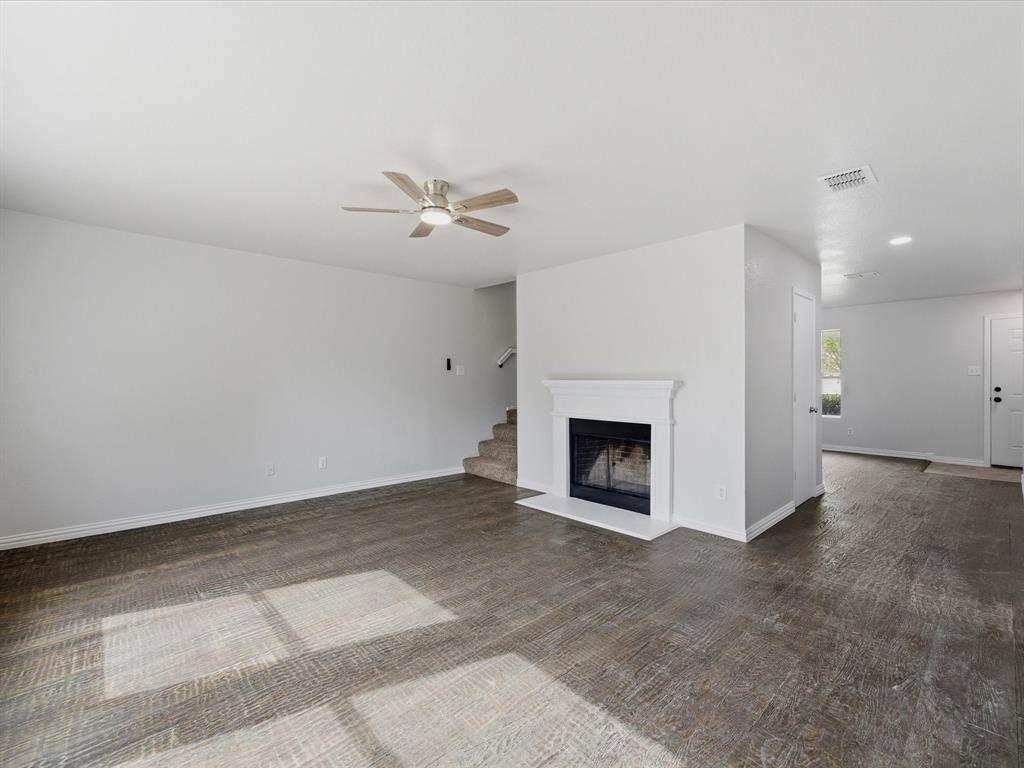 12134 Shine Avenue Rhome, TX 76078 - Photo 11 of 33 a view of a livingroom with a fireplace