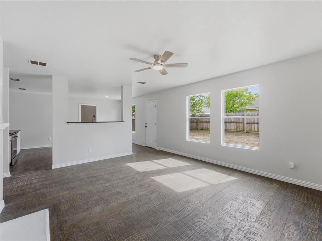 12134 Shine Avenue Rhome, TX 76078 - Photo 12 of 33 a view of a kitchen with a sink hardwood floor and a kitchen view