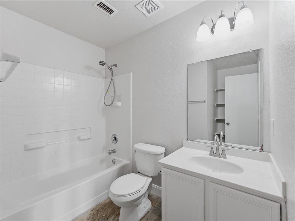 12134 Shine Avenue Rhome, TX 76078 - Photo 20 of 33 a bathroom with a sink a toilet and shower