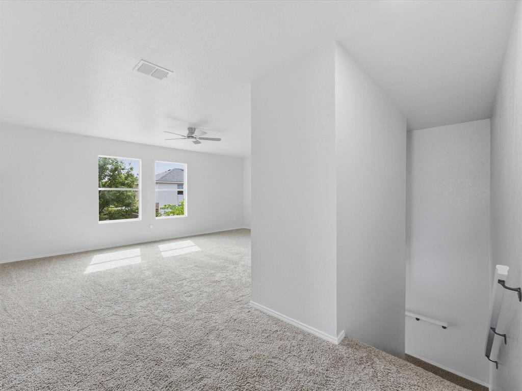 12134 Shine Avenue Rhome, TX 76078 - Photo 21 of 33 an empty room with windows