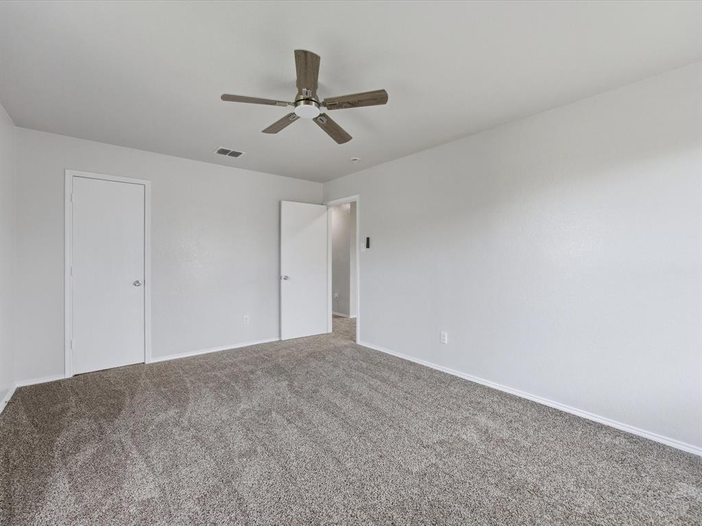 12134 Shine Avenue Rhome, TX 76078 - Photo 22 of 33 a view of a big room with carpet