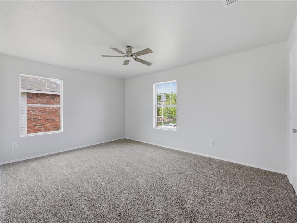12134 Shine Avenue Rhome, TX 76078 - Photo 23 of 33 a view of an empty room with a window