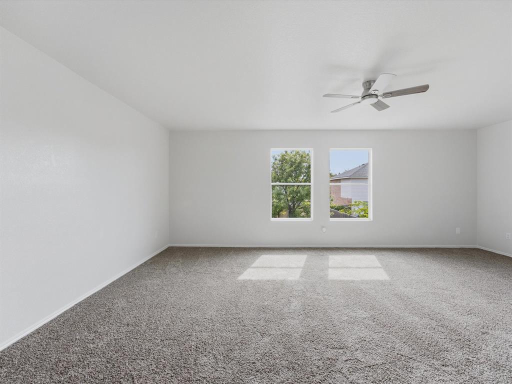 12134 Shine Avenue Rhome, TX 76078 - Photo 25 of 33 an empty room with windows