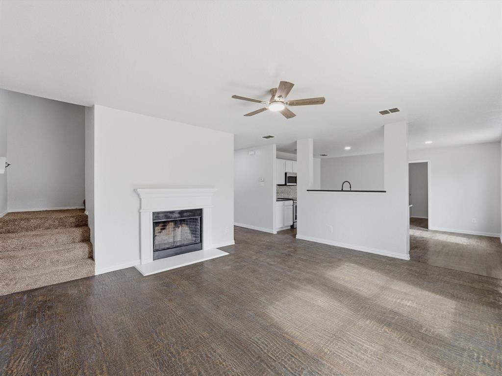 12134 Shine Avenue Rhome, TX 76078 - Photo 10 of 33 a view of a room fire place and a kitchen