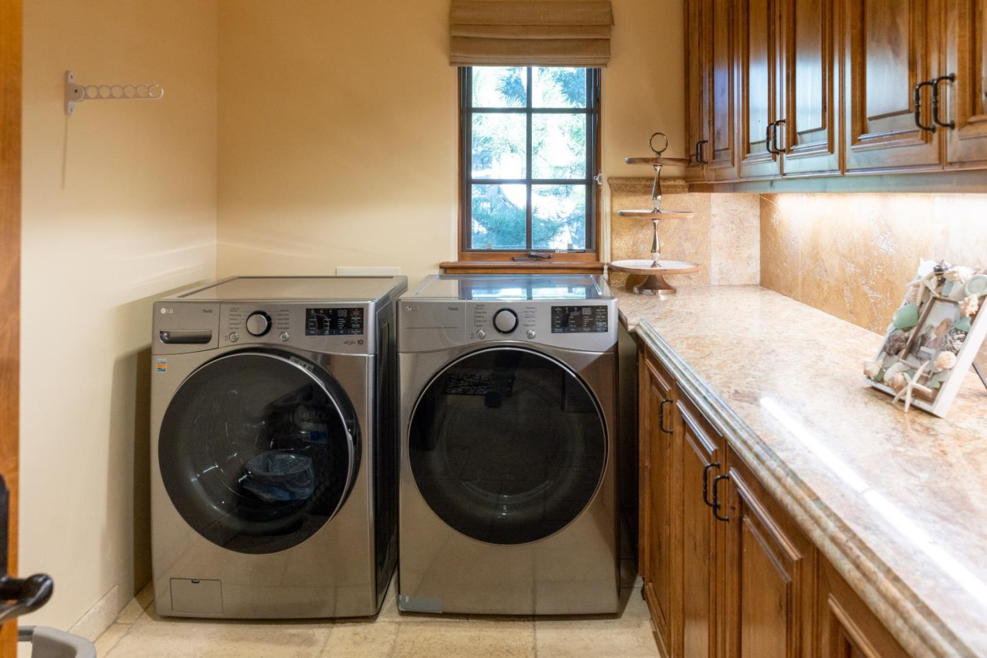 3116 Bird Rock Road Pebble Beach, CA 93953 - Photo 13 of 37 a utility room with sink dryer and washer