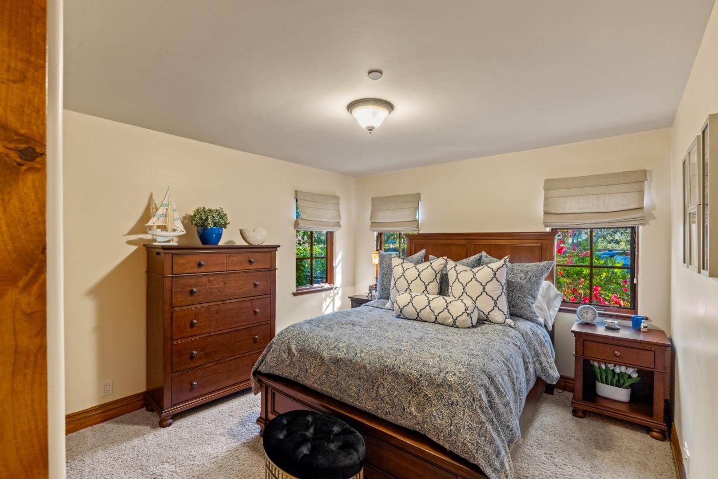 3116 Bird Rock Road Pebble Beach, CA 93953 - Photo 15 of 37 a bedroom with a bed and a dresser
