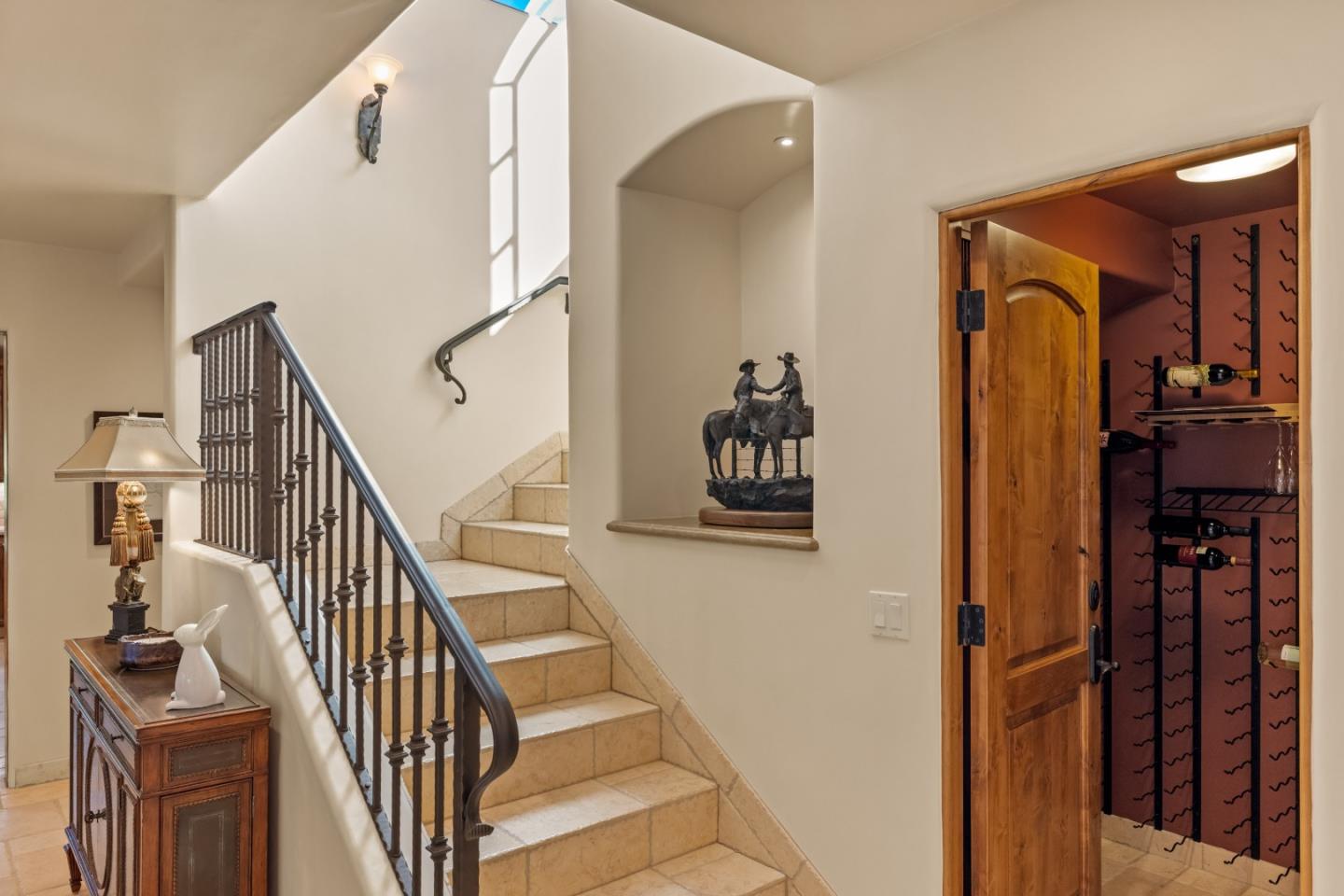 3116 Bird Rock Road Pebble Beach, CA 93953 - Photo 20 of 37 a view of hallway with stairs and furniture