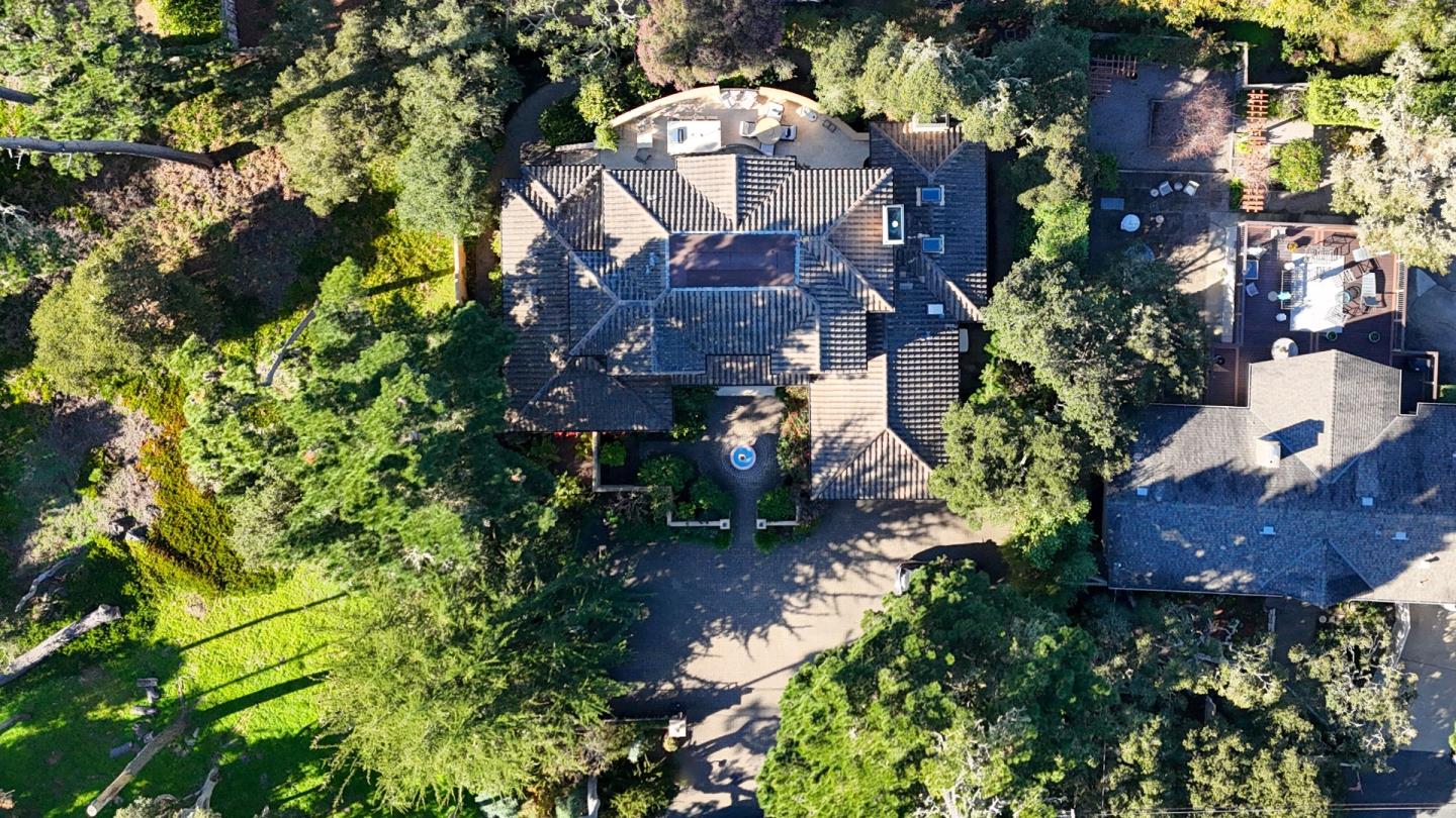 3116 Bird Rock Road Pebble Beach, CA 93953 - Photo 35 of 37 an aerial view of a house with a yard and large trees