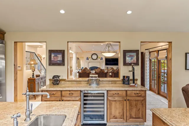 a view of living room with granite countertop furniture and fireplace