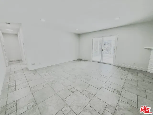 a view of an empty room and entryway