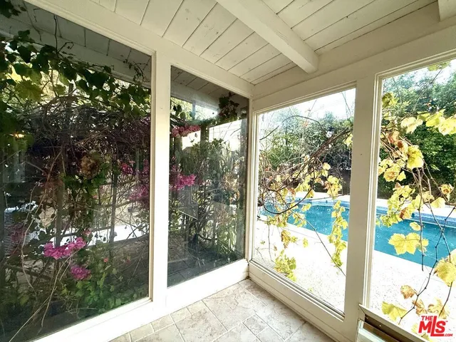 a view of a swimming pool with a yard