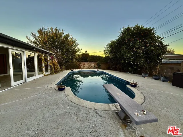 a front view of a house with fountain